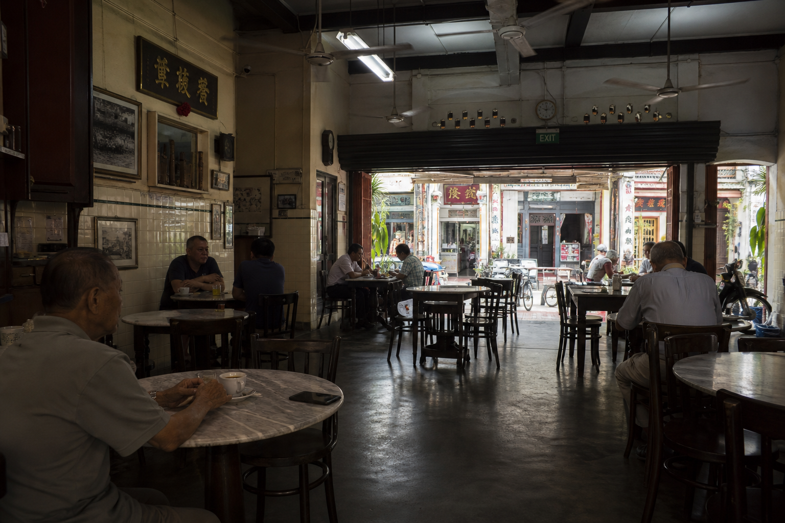 Kreta Ayer coffeeshop interior — marble tables, ceiling fans, midweek morning light