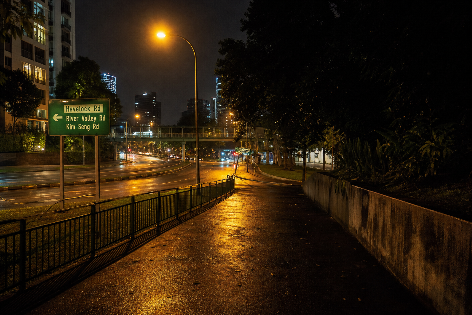 Evening footpath toward Havelock Road — streetlights, wet kerb, descending slope
